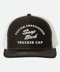 Custom Embroidered Snapback Trucker Hat - Black and white trucker cap with embroidered text on a white background