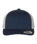 Navy and silver trucker cap on a white background