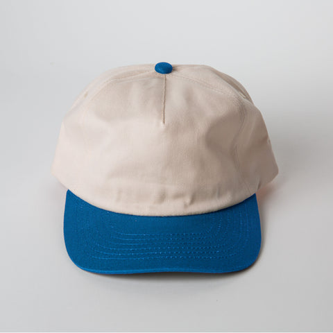 Vintage Style Hat Cerulean Blue and Natural - Beige and blue cap on a light gray background