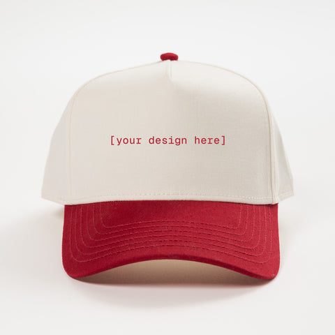 Red and beige cap with 'your design here' text on a white background