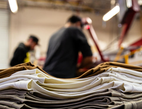 Stack of Shirts prepared for custom screen printing  - Arroyo Manufacturing Co. Warehouse in Chico, CA