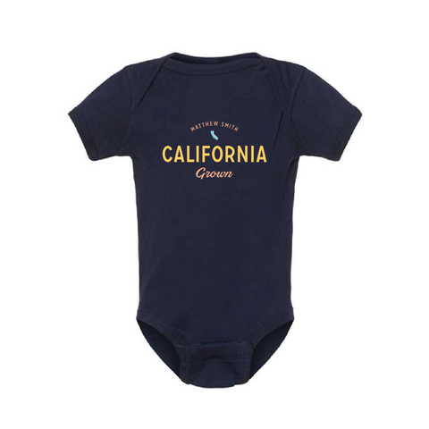 Full body shot of baby onesie with custom text example