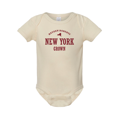 Full body shot of baby onesie with custom text example