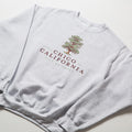 Gray sweatshirt with 'Chico California City of Trees' text and tree graphic on a white background