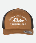 Custom Embroidered Retro Trucker Cap - Brown and black trucker cap with white text on a light gray background